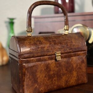 Elegant Brown Mini Bag with Gold Accents